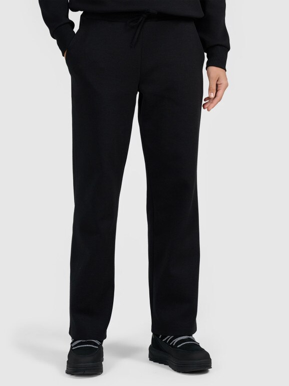 Damskie spodnie dresowe z szerokimi nogawkami 4F 4FRAW25TTROF1919 - czarne