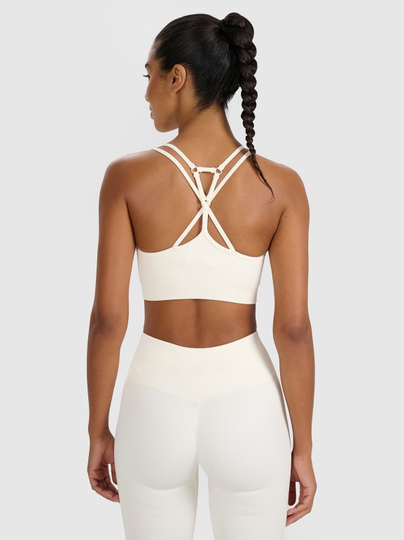 Damski biustonosz treningowy 4F 4FWAW25USBAF218 - beżowy