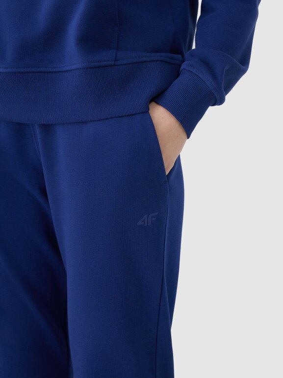 Damskie spodnie dresowe joggery 4F 4FWMM00TTROF1138 - granatowe