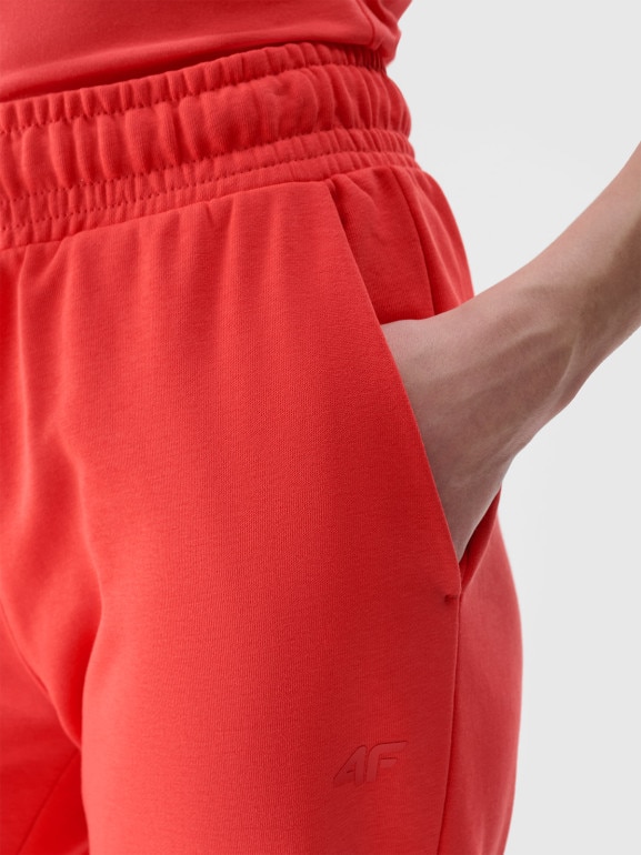 Damskie spodnie dresowe joggery 4F 4FWMM00TTROF1138 - czerwone