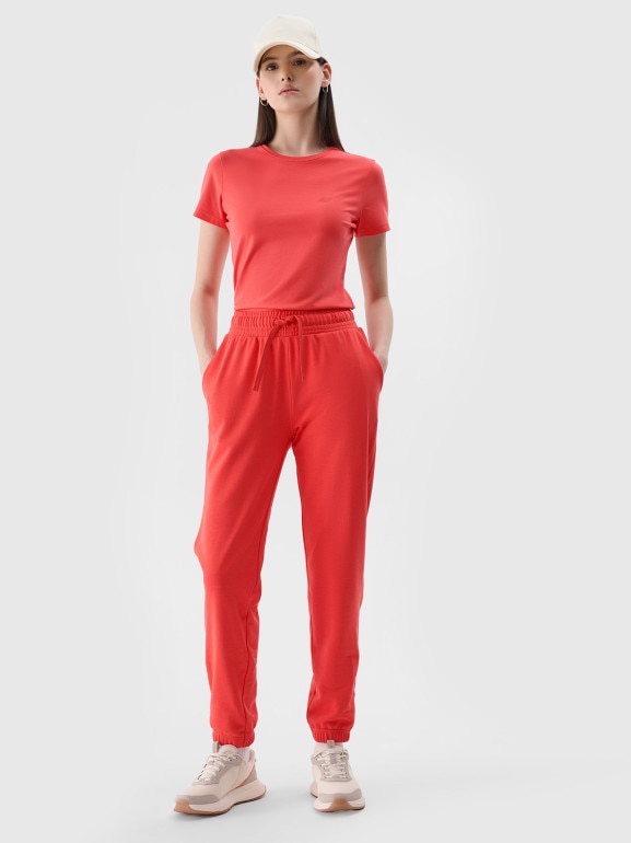 Damskie spodnie dresowe joggery 4F 4FWMM00TTROF1138 - czerwone