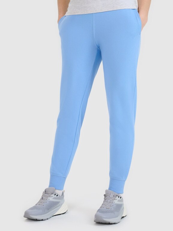 Damskie spodnie dresowe joggery 4F 4FWMM00TTROF1386 - niebieskie