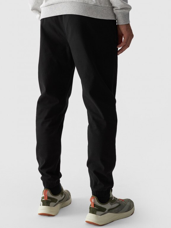 Męskie spodnie casual joggery 4F 4FWMM00TTROM0944 - czarny