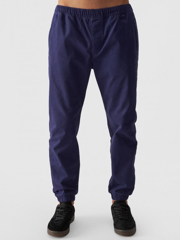 Męskie spodnie casual joggery 4F 4FWMM00TTROM0944 - granatowy