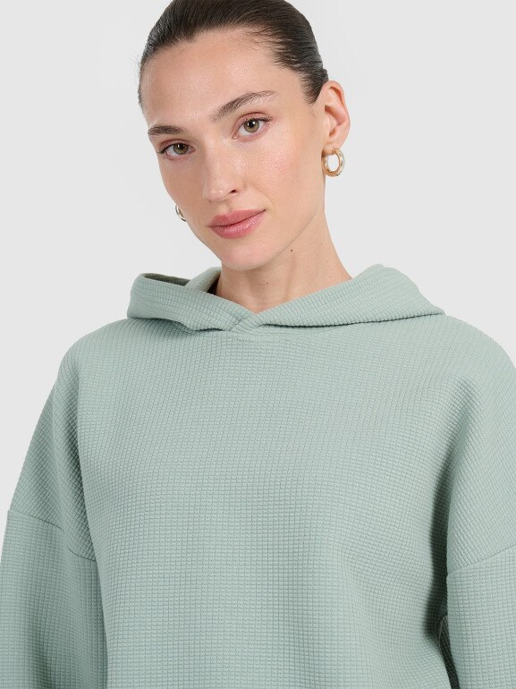 Damska bluza dresowa nierozpinana z kapturem 4F 4FWAW25TSWSF1847 - zielona