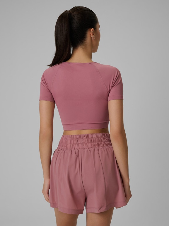 Damski crop top treningowy 4F 4FWSS26TFTSF1812 - różowy