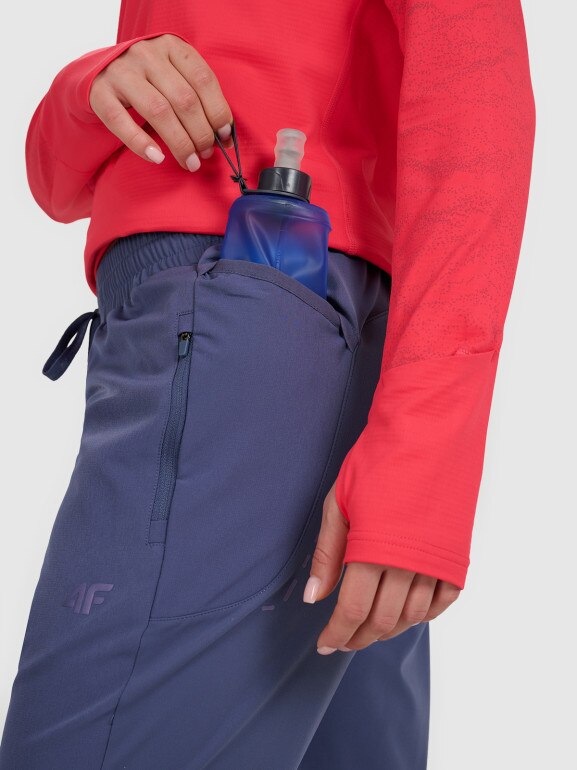 Damskie spodnie do biegania w terenie 4F 4FWAW25TFTRF0931 - niebieskie