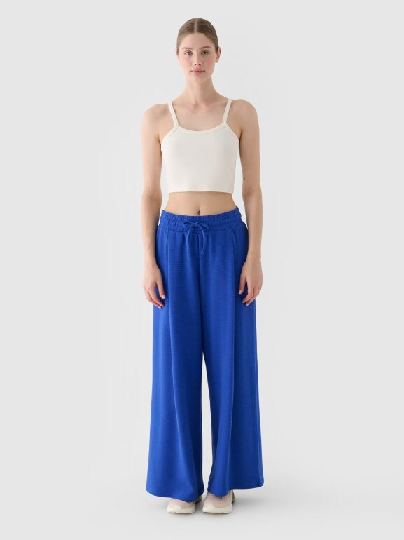 Damskie spodnie dresowe 4F 4FRSS24TTROF1331 - niebieskie
