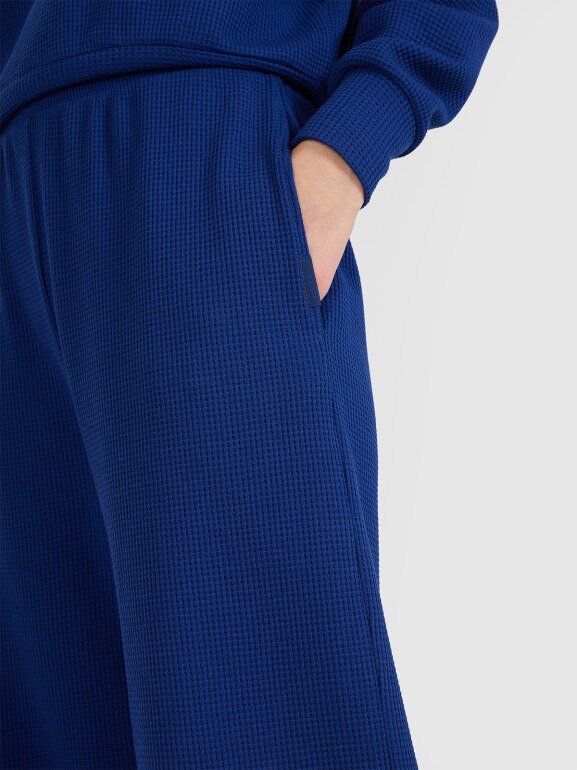 Damskie spodnie dresowe 4F 4FRSS25TTROF1397 - niebieskie