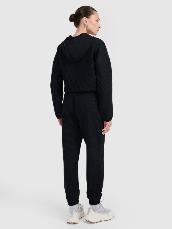 Damskie spodnie dresowe 4F 4FWAW25TTROF1184 - czarne