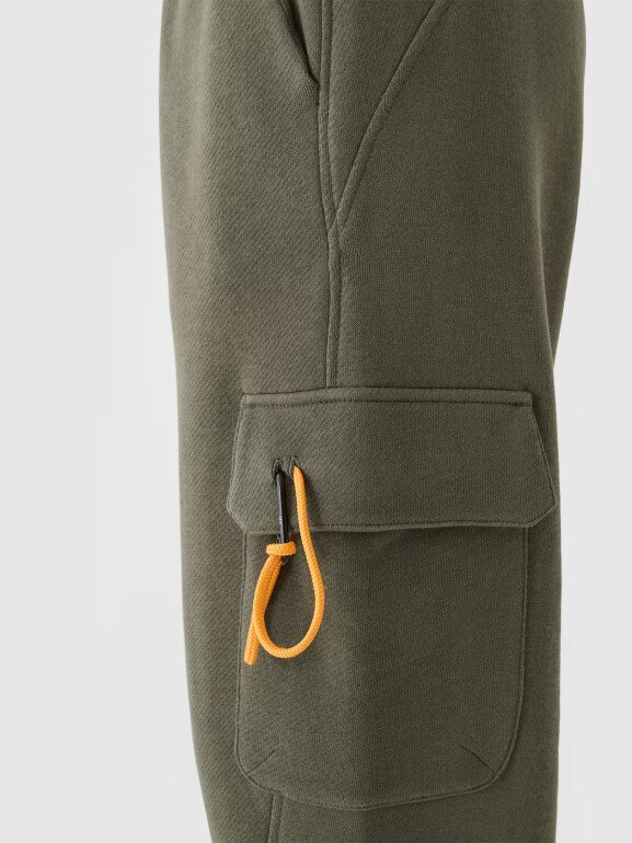 Damskie spodnie dresowe joggery 4F 4FRAW24TTROF1353 - oliwkowe/khaki