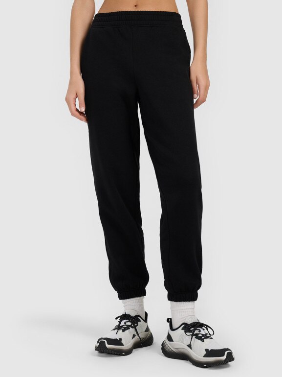 Damskie spodnie dresowe joggery 4F 4FRMM00TTROF1842 - czarne