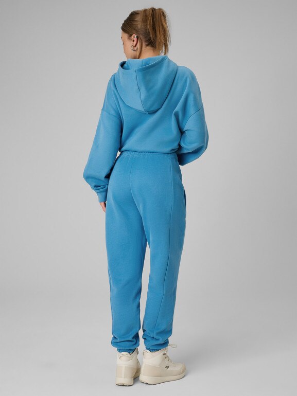 Damskie spodnie dresowe joggery 4F 4FRSS26TTROF1724 - niebieskie