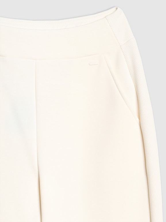 Damskie spodnie dresowe joggery 4F 4FWAW25TTROF1180 - białe