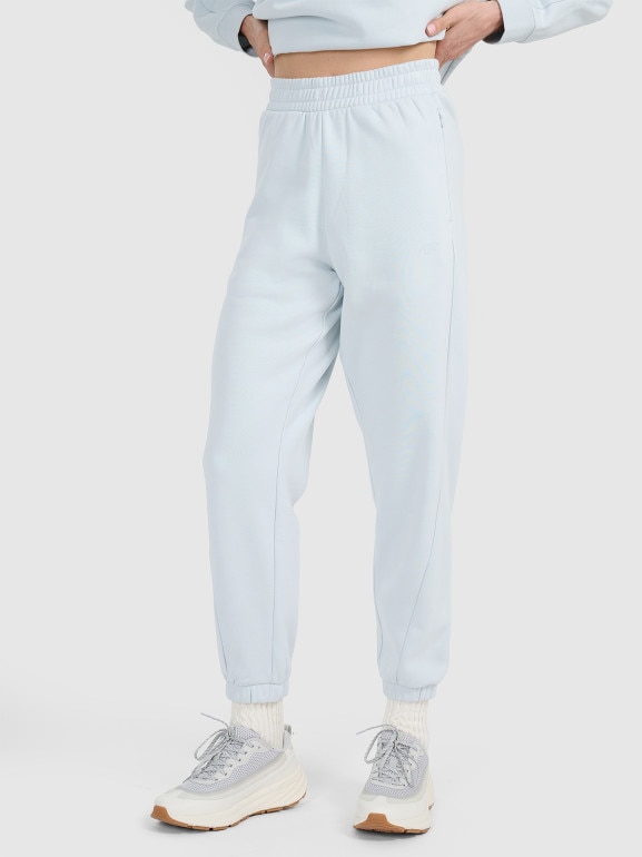 Damskie spodnie dresowe joggery 4F 4FWAW25TTROF1185 - niebieskie