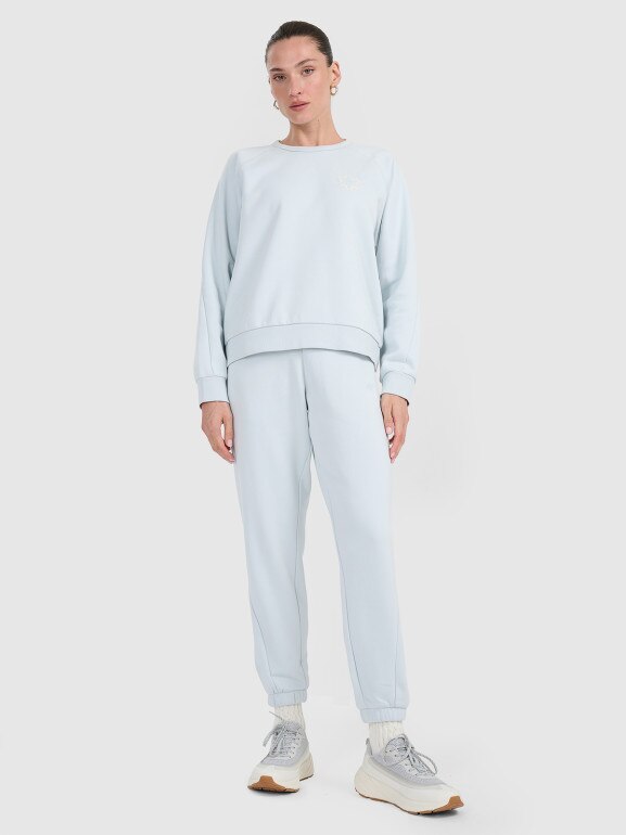 Damskie spodnie dresowe joggery 4F 4FWAW25TTROF1185 - niebieskie