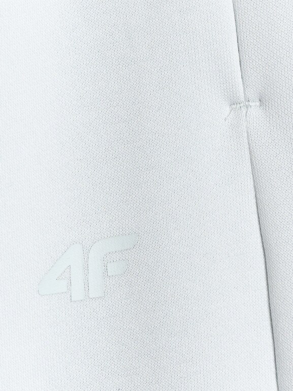 Damskie spodnie dresowe joggery 4F 4FWAW25TTROF1185 - niebieskie