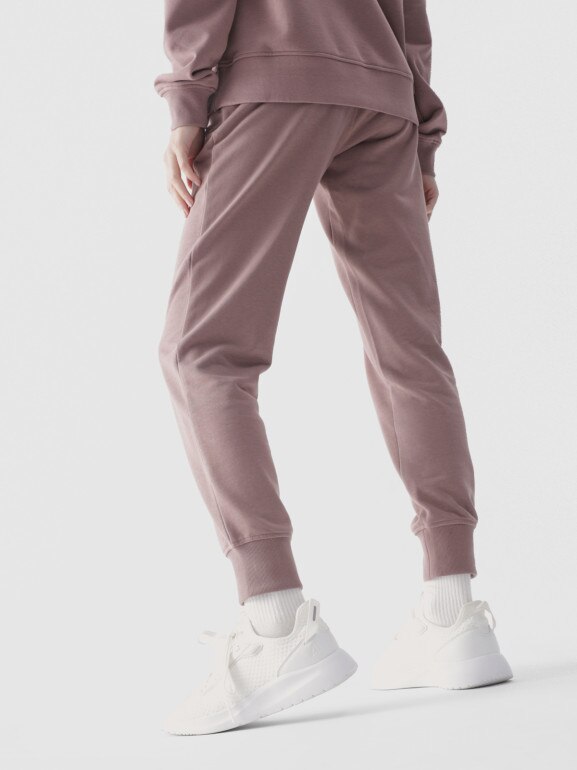 Damskie spodnie dresowe joggery 4F 4FWMM00TTROF0945 - beżowe