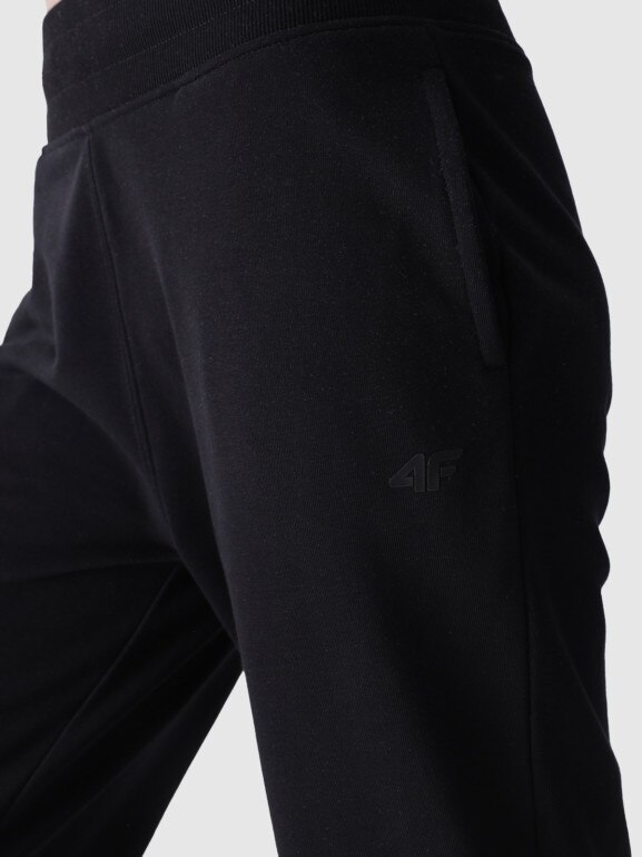Damskie spodnie dresowe joggery 4F 4FWMM00TTROF0945 - czarne