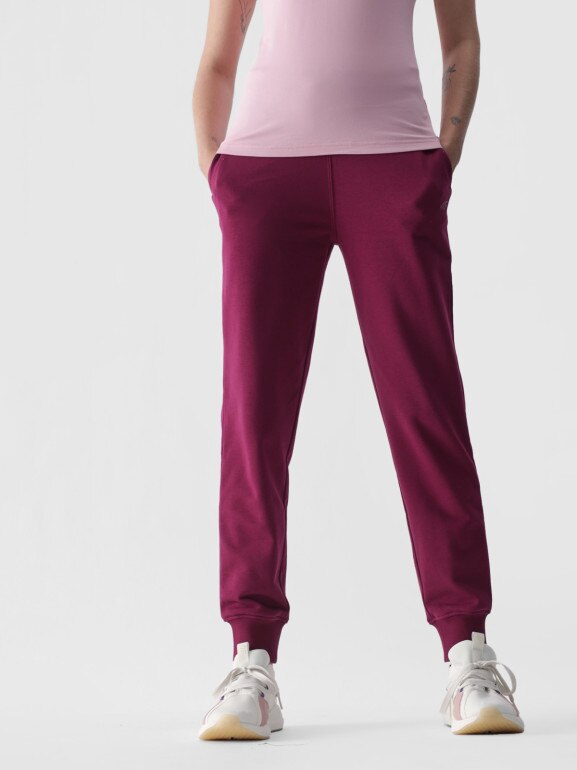 Damskie spodnie dresowe joggery 4F 4FWMM00TTROF0945 - różowe