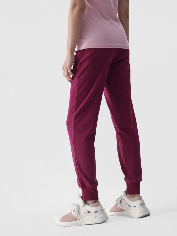 Damskie spodnie dresowe joggery 4F 4FWMM00TTROF0945 - różowe
