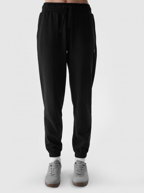 Damskie spodnie dresowe joggery 4F 4FWMM00TTROF1138 - czarne 