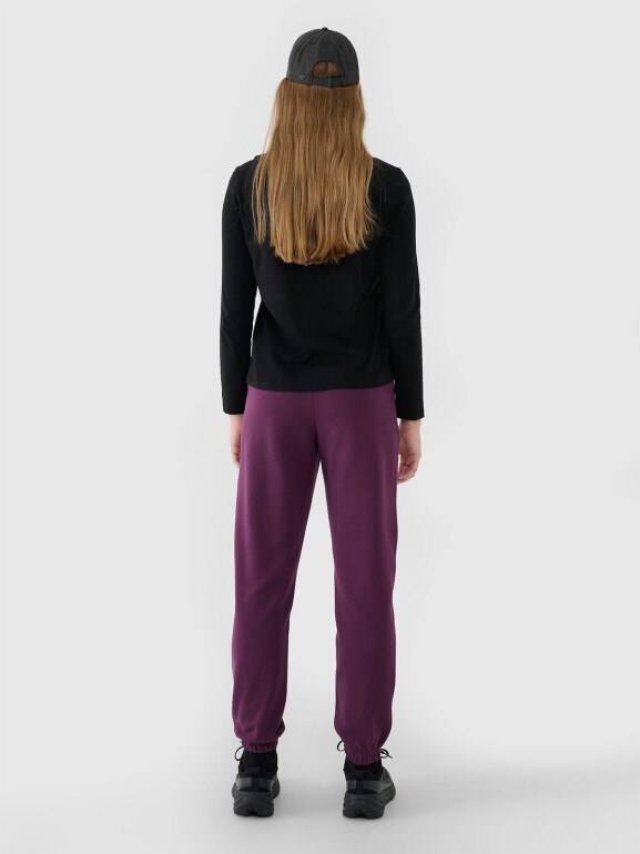 Damskie spodnie dresowe joggery 4F 4FWSS25TTROF1013 - fioletowe