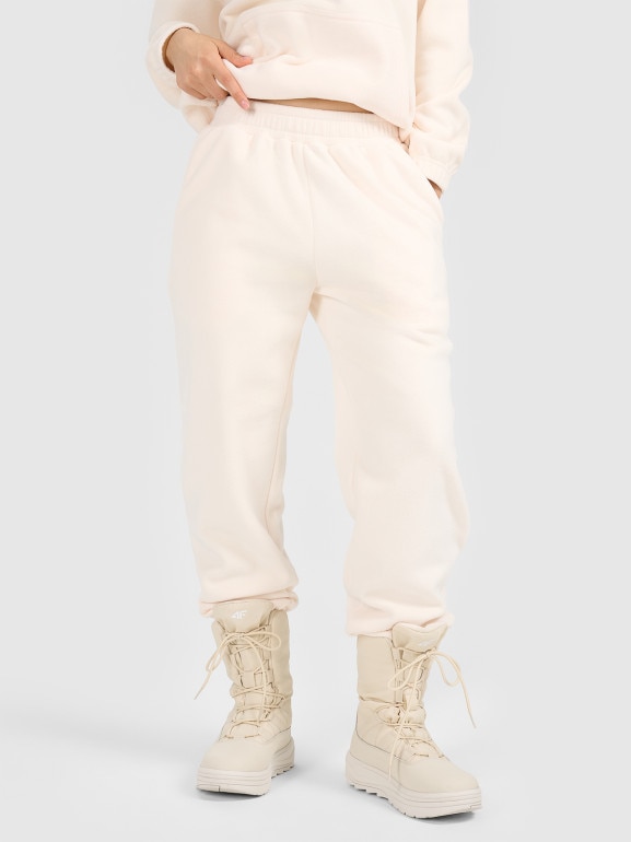 Damskie spodnie dresowe joggery polarowe 4F 4FRAW25TTROF1707 - białe