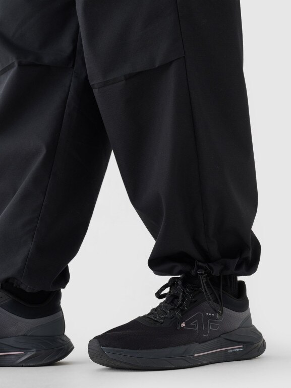 Damskie spodnie oversize parachute 4F 4FRSS24TTROF1330 - czarne