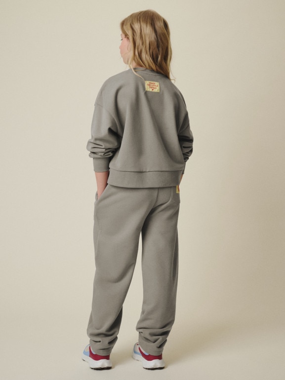 Dziewczęce spodnie dresowe 4F 4FJRSS26TTROF1871 - beżowe