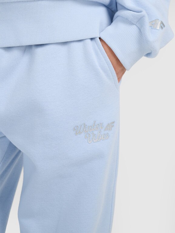Dziewczęce spodnie dresowe joggery 4F 4FJRAW25TTROF1642 - niebieskie