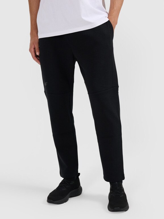 Męskie spodnie dresowe 4F 4FWAW25TTROM1193 - czarne