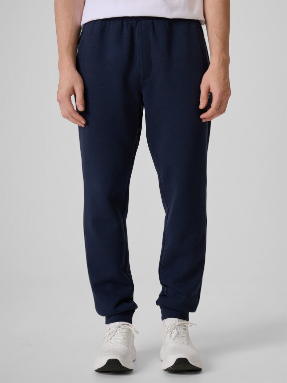 Męskie spodnie dresowe joggery 4F 4FRSS26TTROM1917 - granatowe