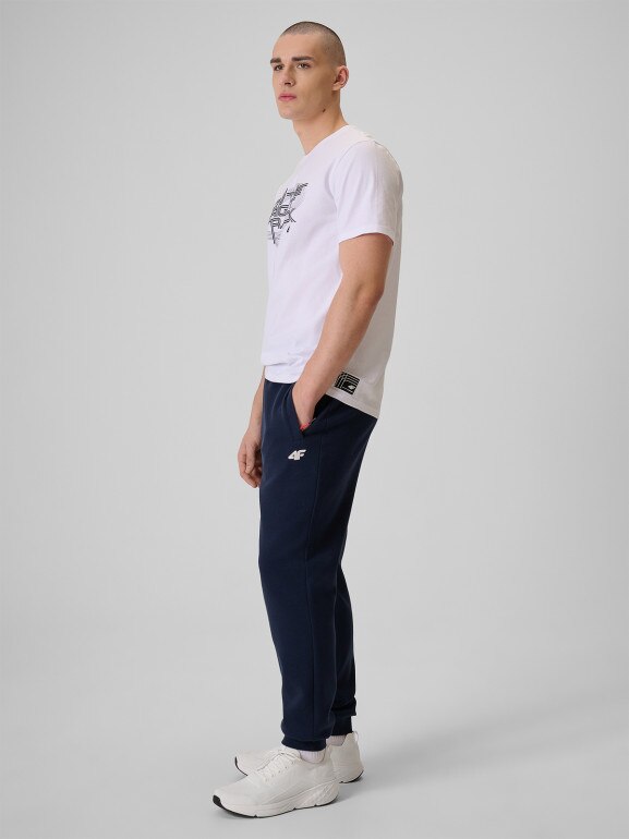 Męskie spodnie dresowe joggery 4F 4FRSS26TTROM1917 - granatowe