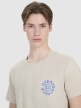 Męski t-shirt z nadrukiem 4F 4FWSS25TTSHM1980 - beżowy