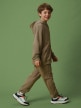  4F JUNIOR Chłopięce spodnie dresowe joggery 4F 4FJRSS26TTROM1995  beżowe Beżowy