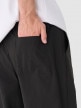 Męskie spodnie casual tkaninowe Outhorn OTHWAW24TTROM0894 - czarne