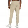 Męskie spodnie dresowe Under Armour UA Rival Terry Jogger - beżowe