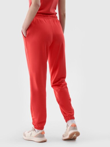 Damskie spodnie dresowe joggery 4F 4FWMM00TTROF1138 - czerwone