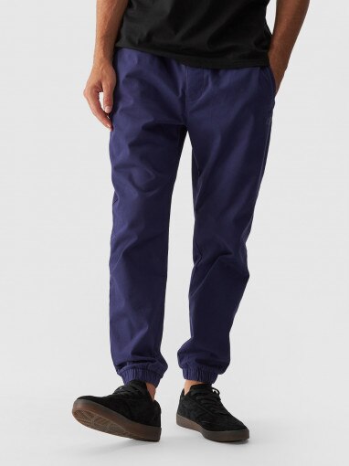 Męskie spodnie casual joggery 4F 4FWMM00TTROM0944 - granatowy
