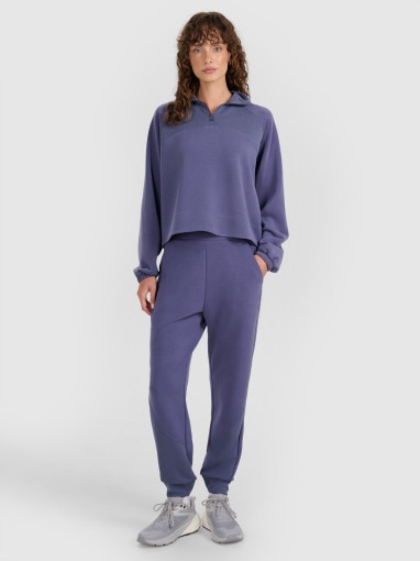 4F Damskie spodnie dresowe joggery 4F 4FWAW25TTROF1180 niebieskie Niebieski