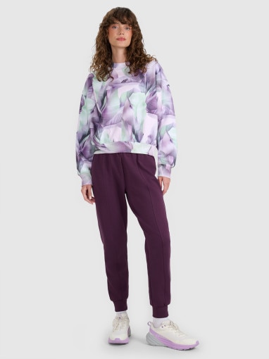 4F Damskie spodnie dresowe joggery 4F 4FWAW25TTROF1196 fioletowe Fioletowy