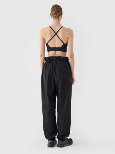 Damskie spodnie oversize parachute 4F 4FRSS24TTROF1330 - czarne