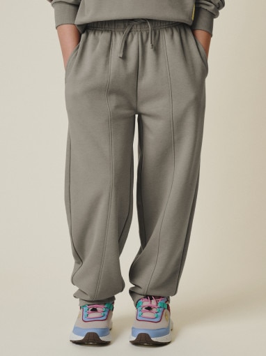 Dziewczęce spodnie dresowe 4F 4FJRSS26TTROF1871 - beżowe