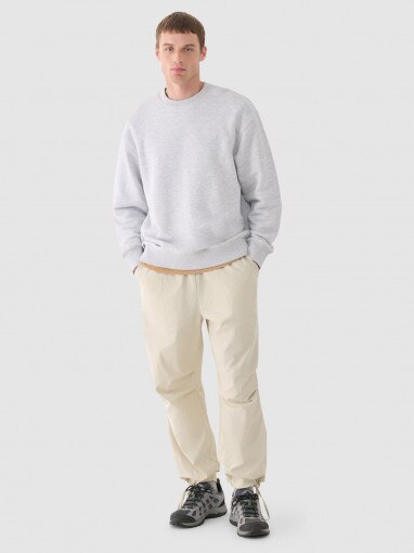 Outhorn Męskie spodnie casual tkaninowe Outhorn OTHWAW24TTROM0894 beżowe Beżowy