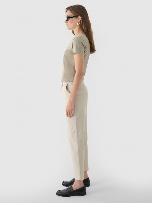 Damskie spodnie casual tkaninowe Outhorn OTHWAW24TTROF1084 - beżowe