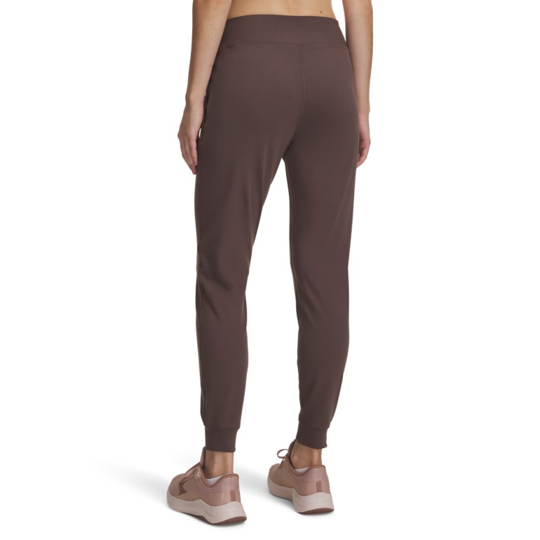 Damskie spodnie treningowe Under Armour Motion Jogger - brązowe