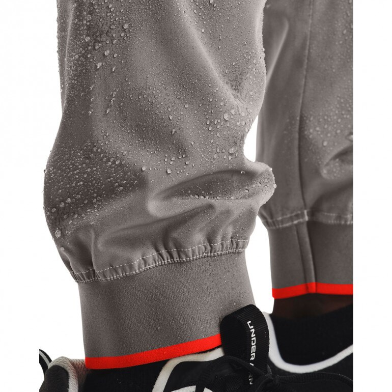 Męskie spodnie treningowe UNDER ARMOUR UA RUSH LEGACY WOVEN PANT - szare